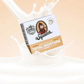Dr. Squatch soap bar packaging with a splash of milk on a beige background